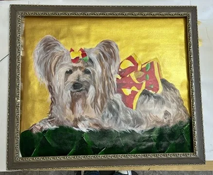Framed painting of a yorkshire terrier on a gold ground